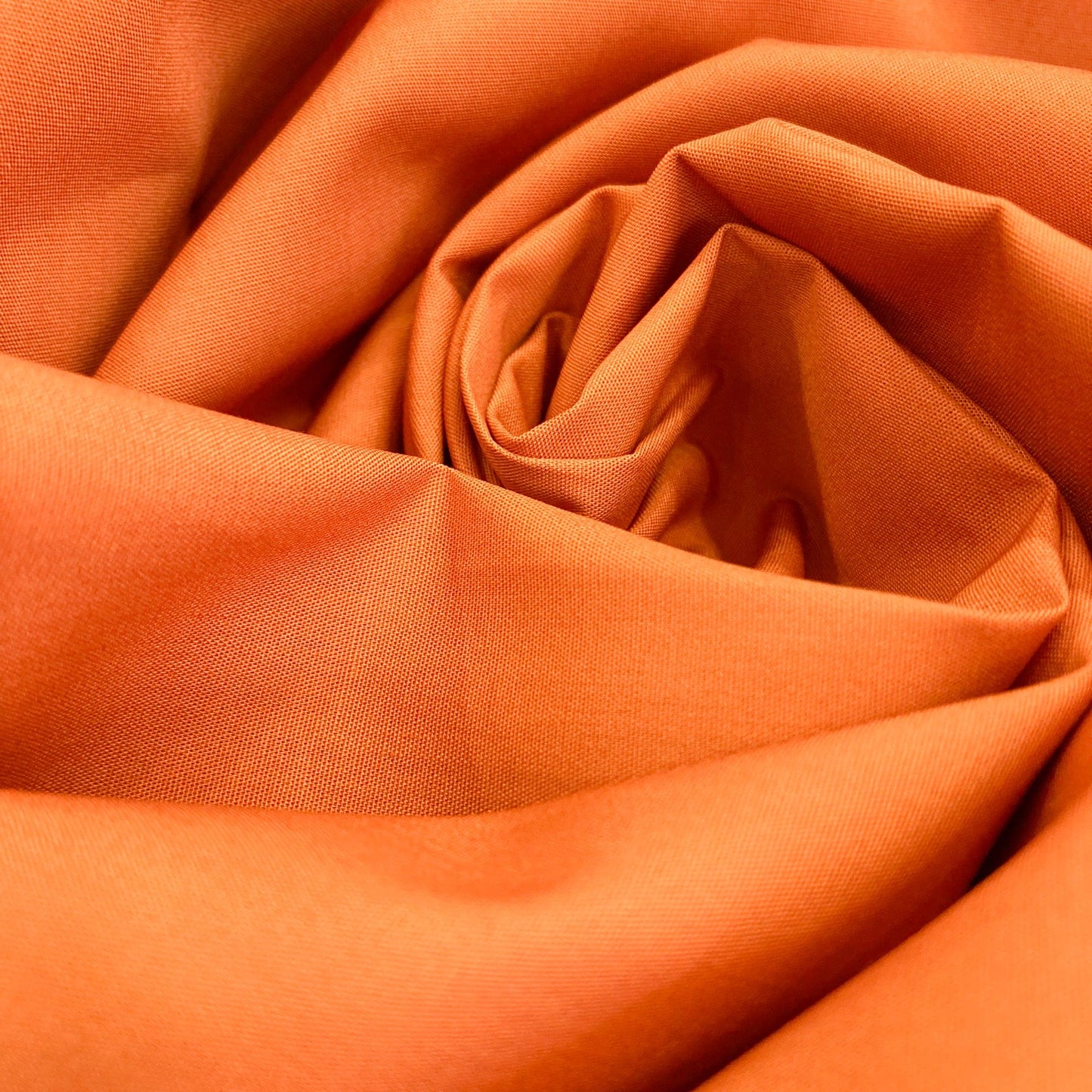 Close-up of Art Gallery Fabrics burnt orange quilting cotton solid