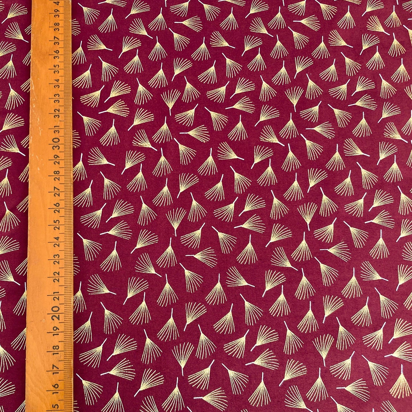 Cotton Fabric in Burgundy with Metallic Pine Leaf Print