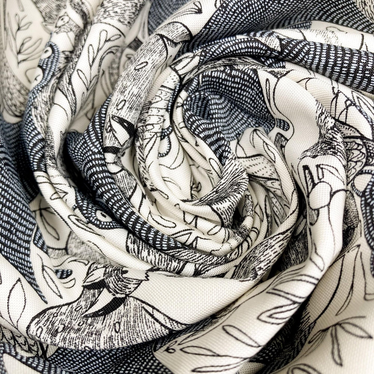 Swirl of cotton fabric with black and white pattern