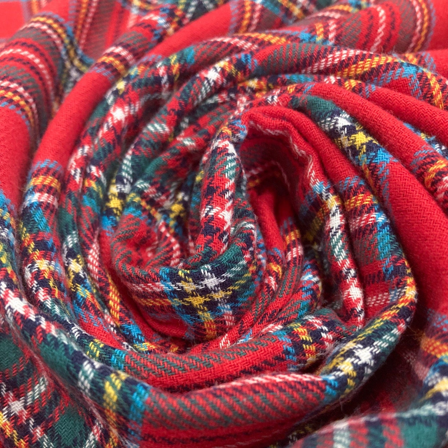 Close-up of a red tartan brushed cotton swirl