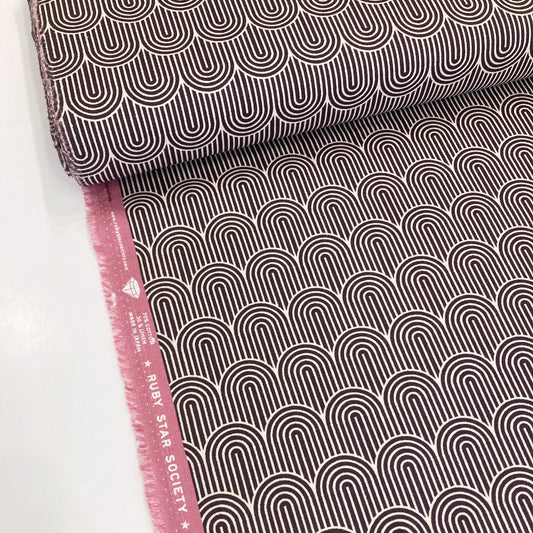 Ruby Star Society cotton and linen canvas fabric with geometric pattern in dark aubergine and cream.