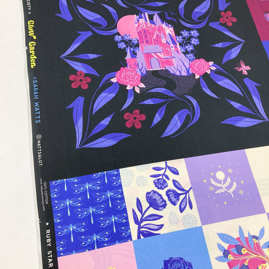 Fabric panel with floral and castle design on a black background