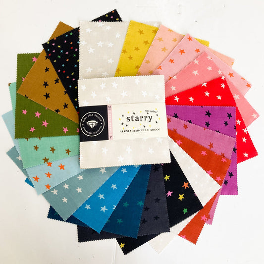 Collection of colorful fabric charm squares from the Ruby Star Society 'Starry' New Colours collection
