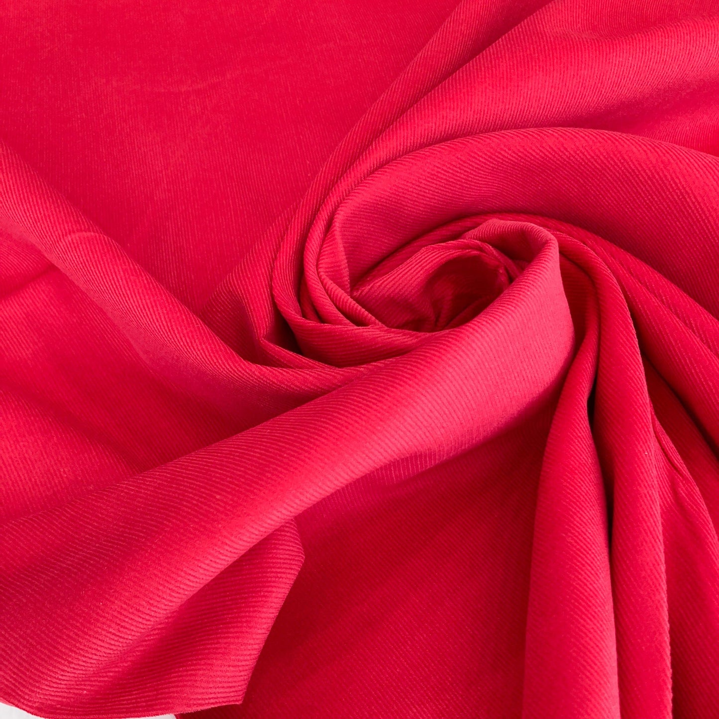 Close-up of a swirled red needlecord fabric