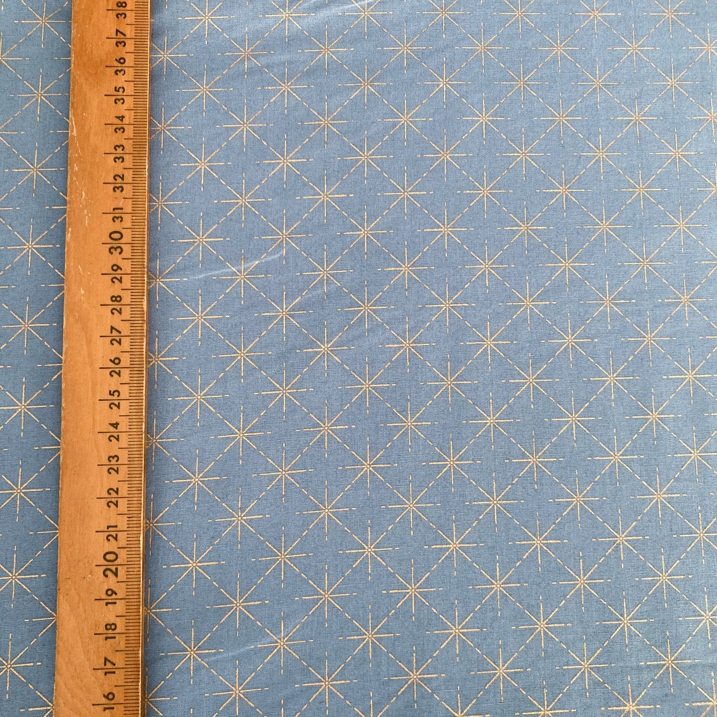 Cotton Fabric in Denim Blue with Metallic Starburst Print