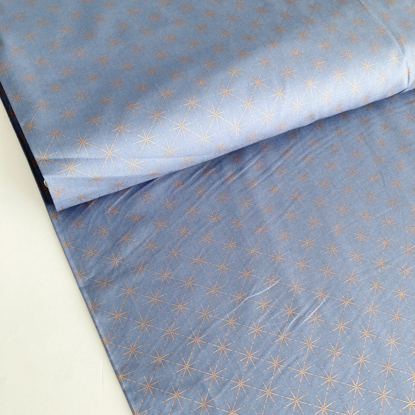 Cotton Fabric in Denim Blue with Metallic Starburst Print