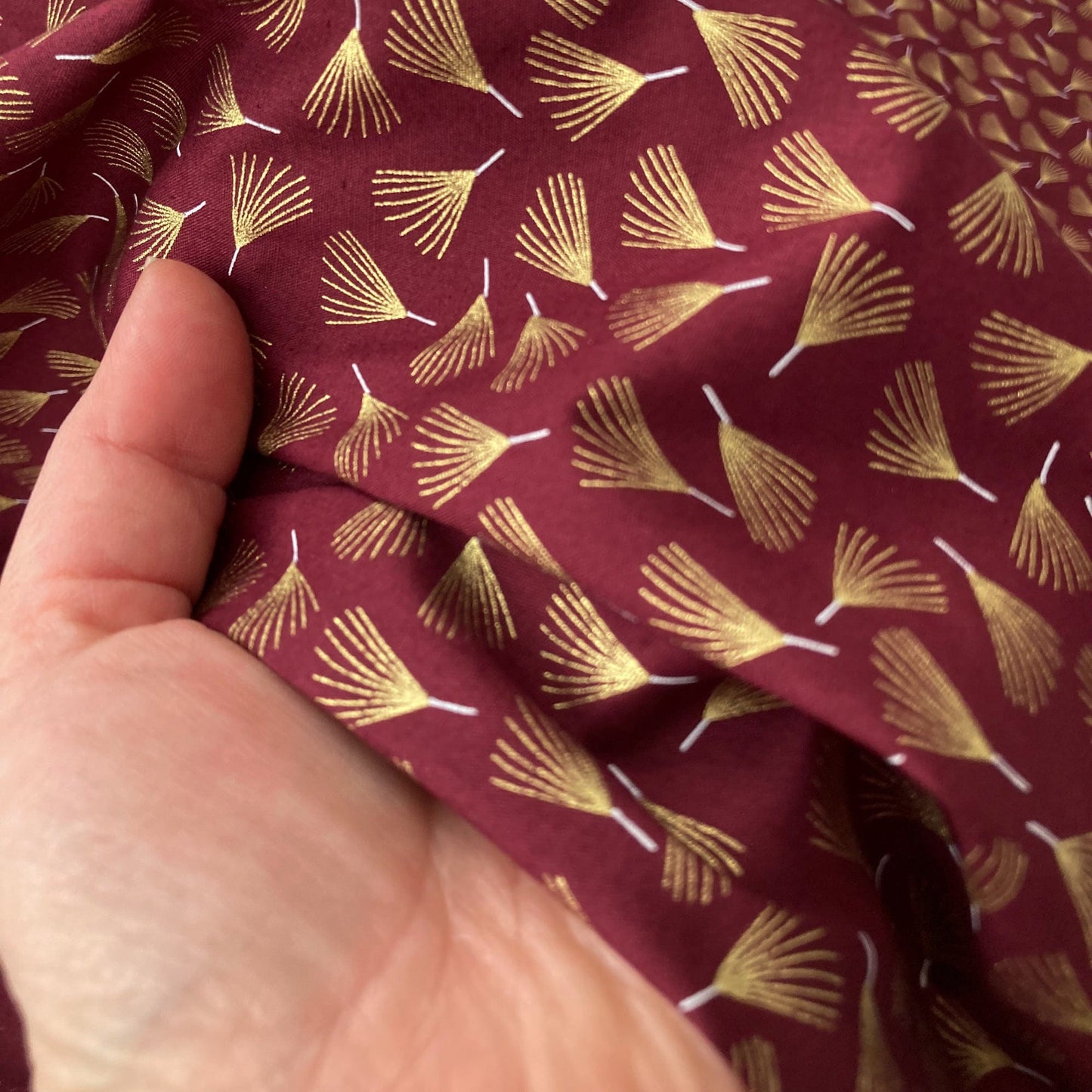 Cotton Fabric in Burgundy with Metallic Pine Leaf Print
