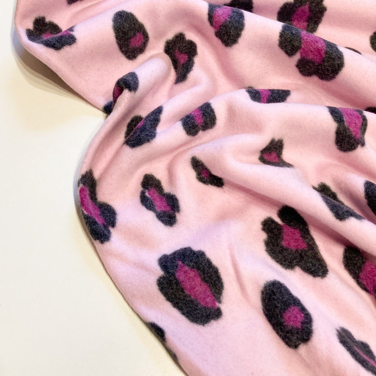 Organic Cotton Fleece with Snow Leopard Print in Pink