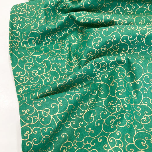 Green quilting cotton with celtic style metallic gold swirl pattern