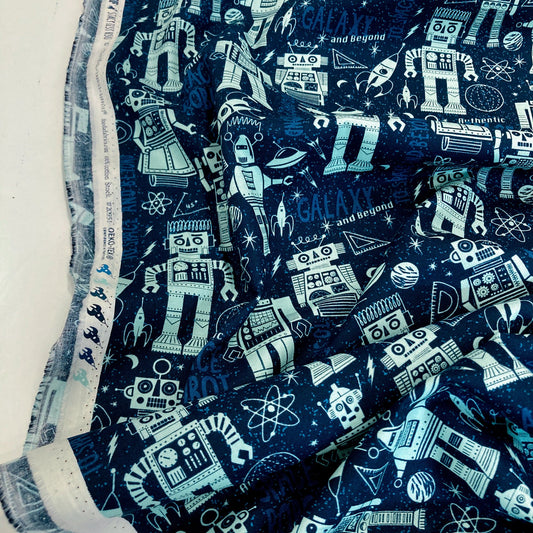 Quilting cotton fabric with robot and space-themed pattern on a blue background