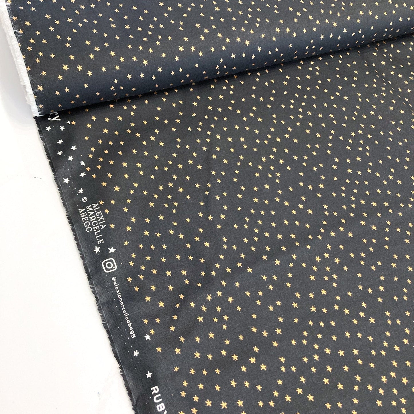 Ruby Star Society Quilting Cotton 'Mini Starry' in Black and Gold