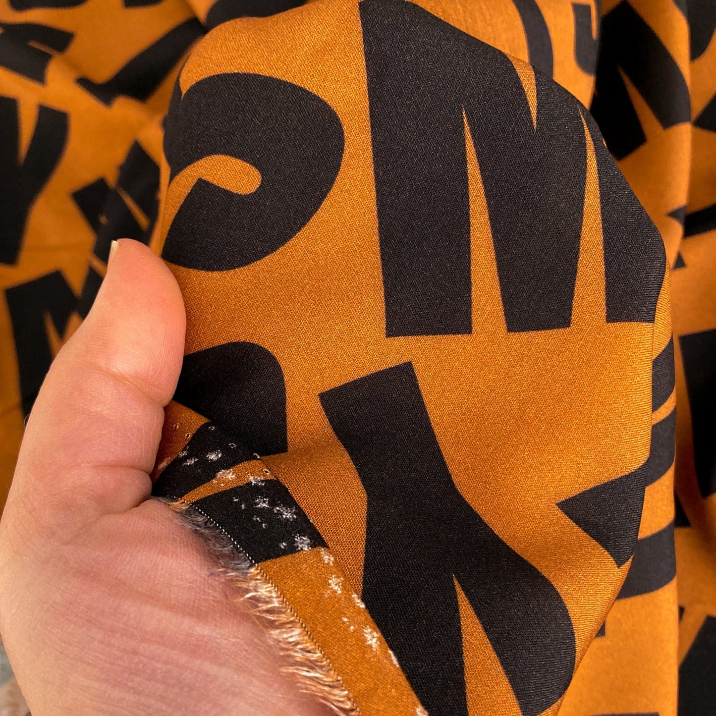 Fine Viscose in Rust Brown with Letter Print