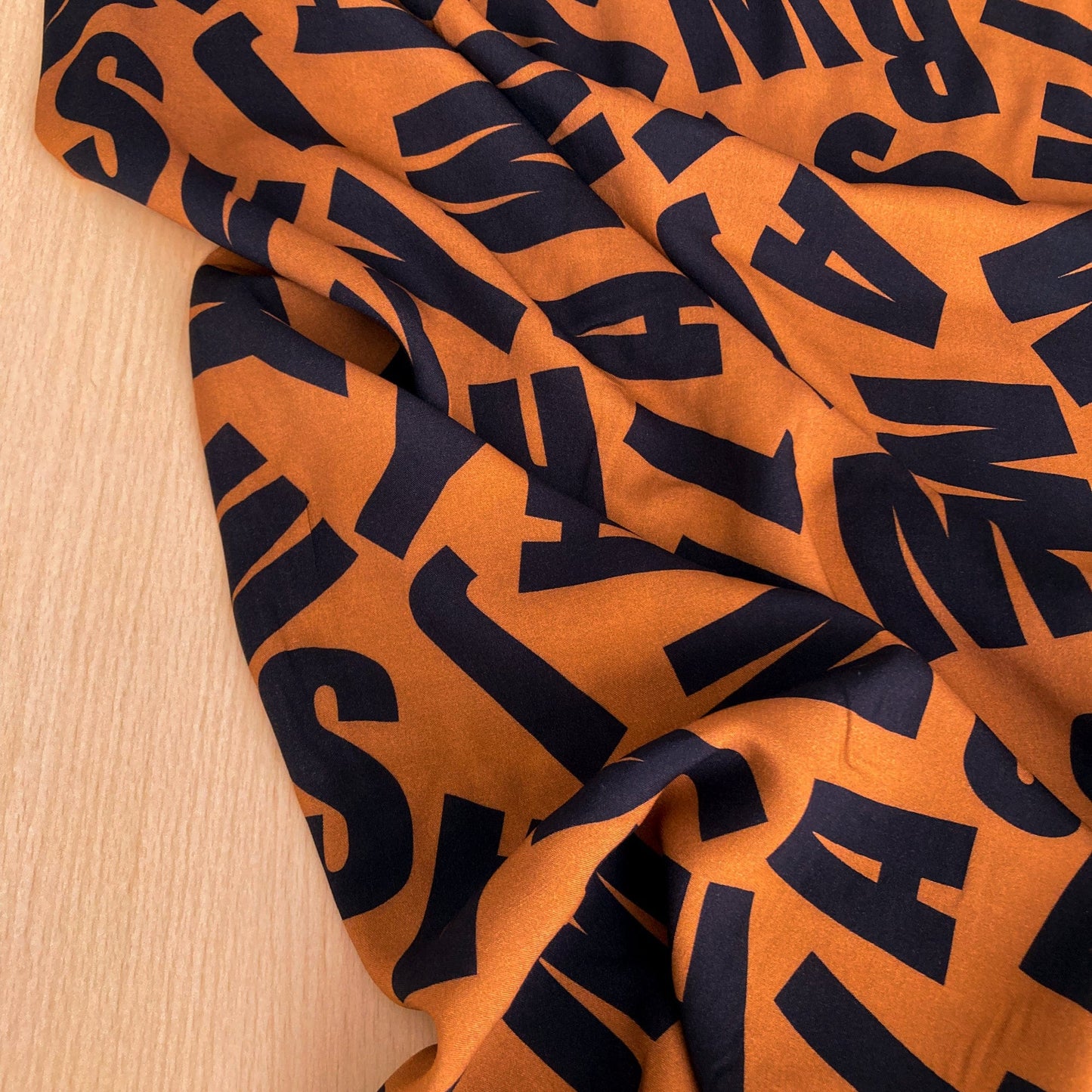 Fine Viscose in Rust Brown with Letter Print