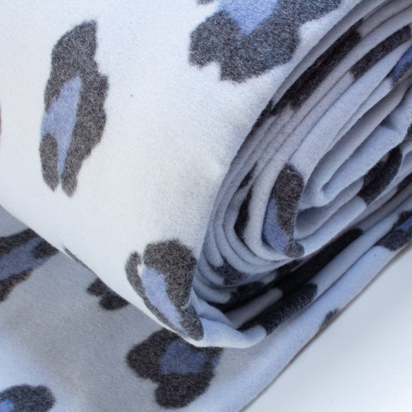 Organic Cotton Fleece with Snow Leopard Print in Blue