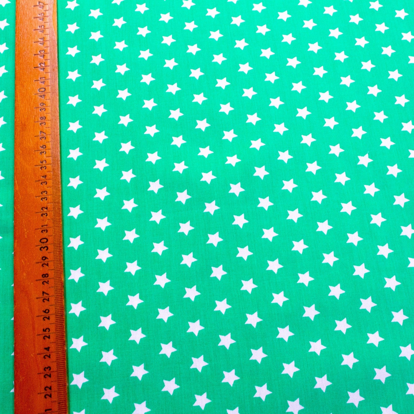 Cotton Poplin in Green with Star Print